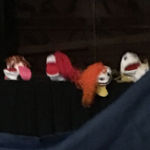 Children watching puppet show